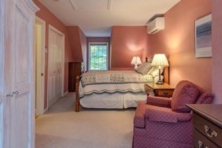 51 Tracey Cove Circle Rome, ME 04963 - Photo 19 of 25 a bedroom with a bed and a couch