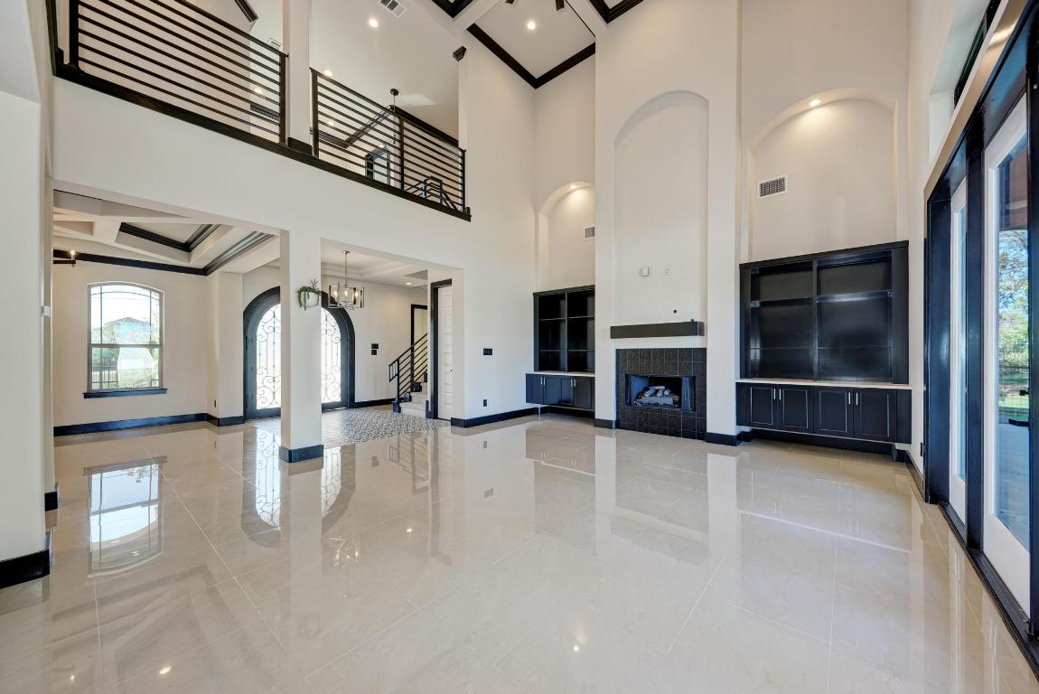 104 Spring Valley Street Hutto, TX 78634 - Photo 12 of 40 a view of a livingroom with an empty space and a fireplace