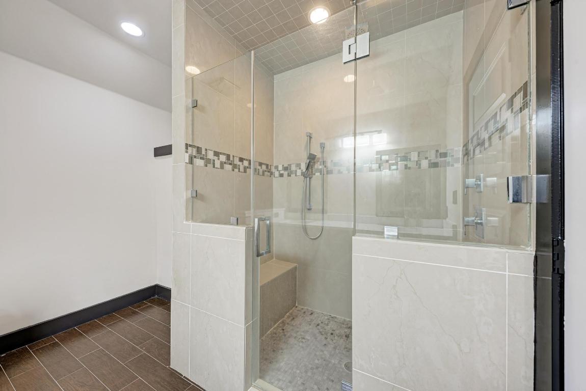 104 Spring Valley Street Hutto, TX 78634 - Photo 23 of 40 a bathroom with a shower and a toilet