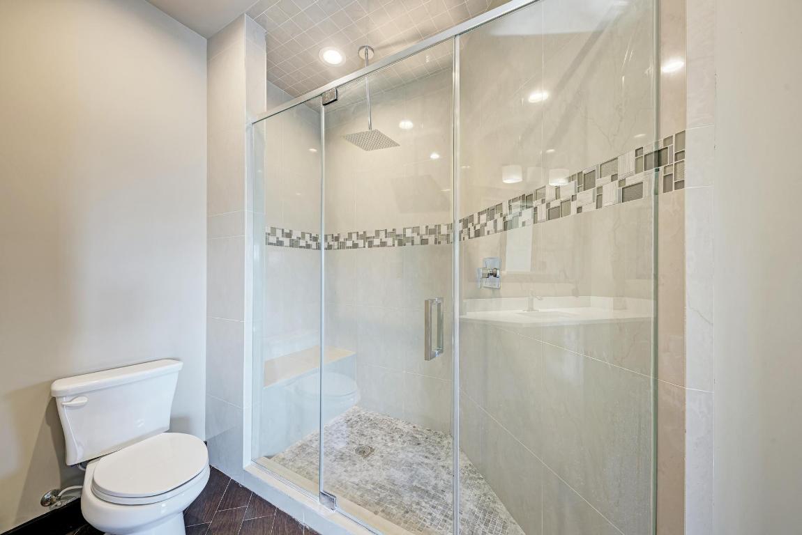 104 Spring Valley Street Hutto, TX 78634 - Photo 26 of 40 a bathroom with a shower a toilet and sink