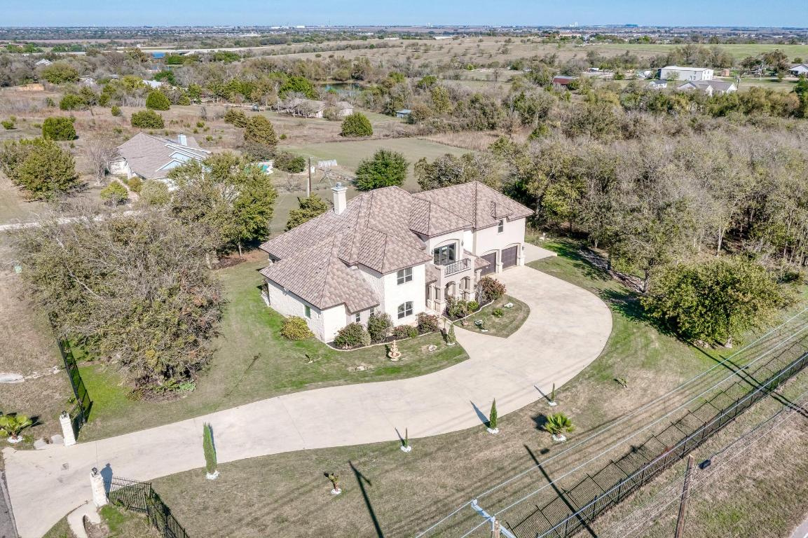 104 Spring Valley Street Hutto, TX 78634 - Photo 3 of 40 an aerial view of a house with a yard
