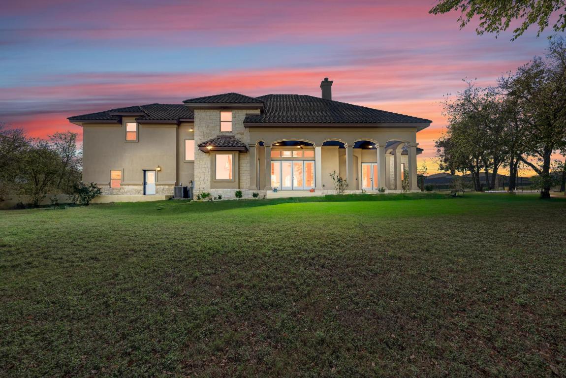 104 Spring Valley Street Hutto, TX 78634 - Photo 33 of 40 a front view of a house with a yard