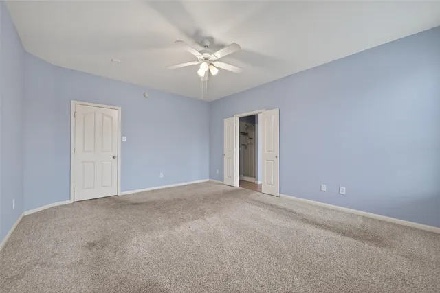 a bathroom with a granite countertop sink a toilet and a bathtub