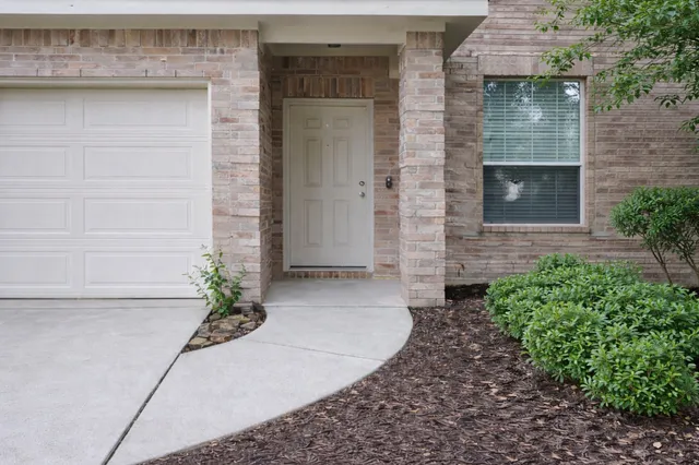 a living room with fireplace furniture and a flat screen tv