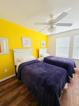 a bedroom with a bed and lamps