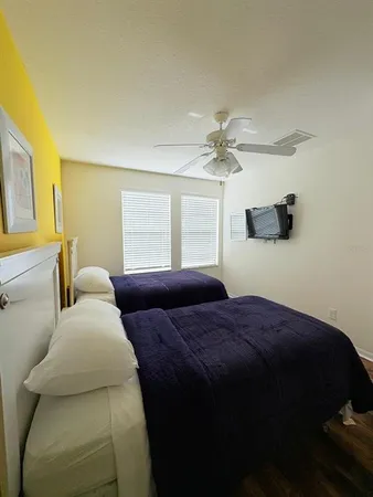 a spacious bedroom with a bed and window