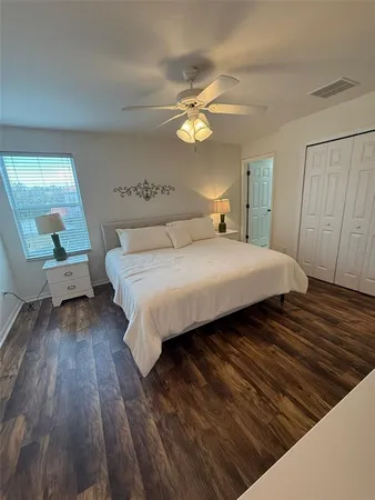 a bedroom with a bed and window