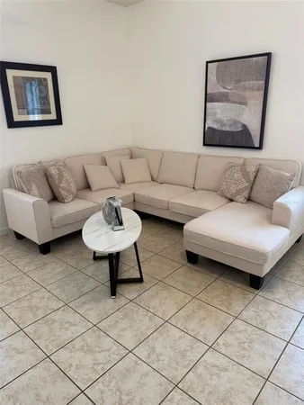 a living room with furniture and a couch