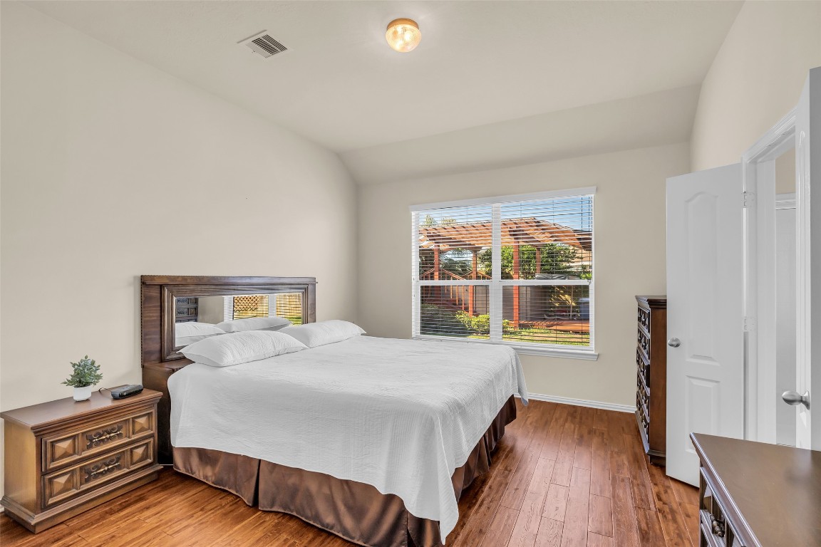 10022 Darrell Springs Lane Tomball, TX 77375 - Photo 12 of 27 a bedroom with a bed and a window