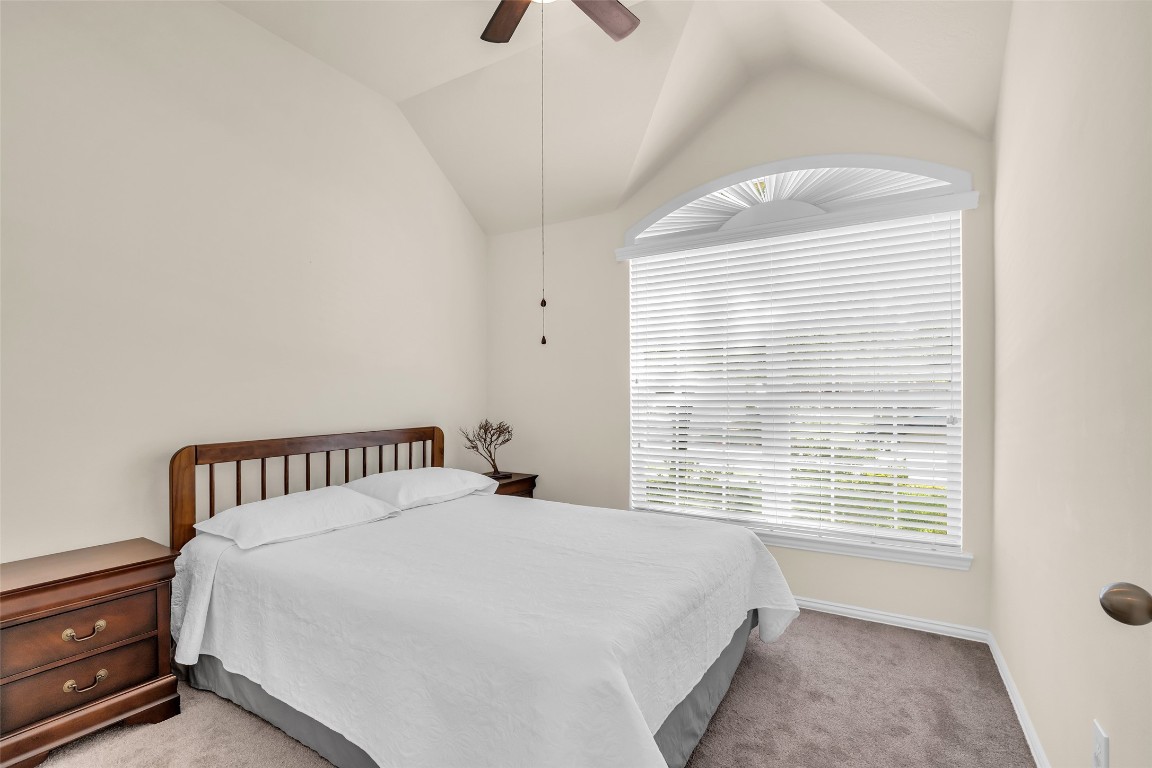 10022 Darrell Springs Lane Tomball, TX 77375 - Photo 15 of 27 a bedroom with a bed and a window
