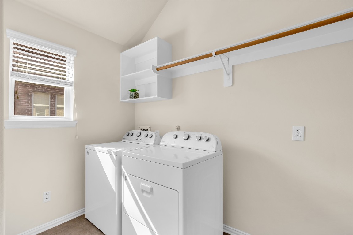 10022 Darrell Springs Lane Tomball, TX 77375 - Photo 16 of 27 a utility room with dryer and washer