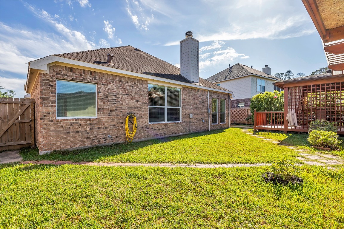 10022 Darrell Springs Lane Tomball, TX 77375 - Photo 27 of 27 a view of a house with a backyard