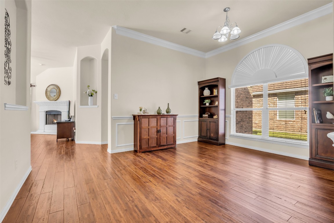 10022 Darrell Springs Lane Tomball, TX 77375 - Photo 3 of 27 a view of an empty room with wooden floor and a window