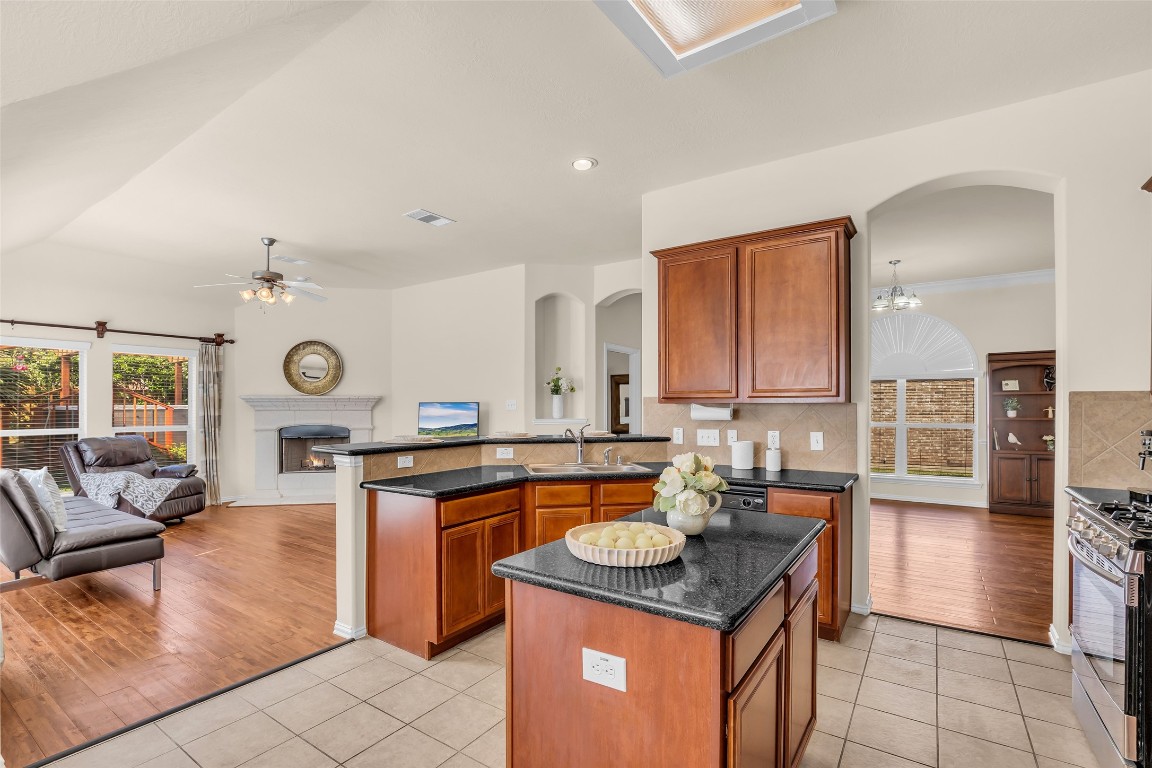 10022 Darrell Springs Lane Tomball, TX 77375 - Photo 7 of 27 a kitchen with stainless steel appliances granite countertop a stove a sink and a refrigerator