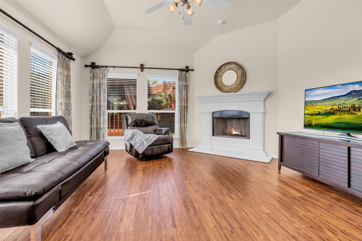 10022 Darrell Springs Lane Tomball, TX 77375 - Photo 10 of 27 a living room with furniture fireplace and flat screen tv
