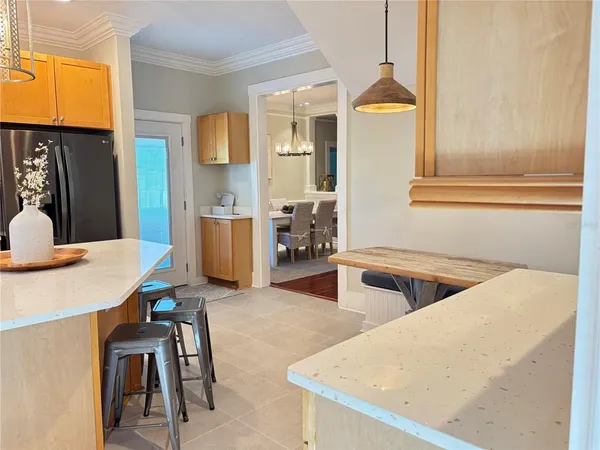 a kitchen with a table and chairs