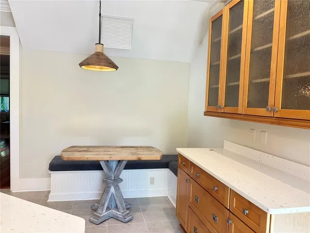 a bathroom with a double vanity sink mirror and shower