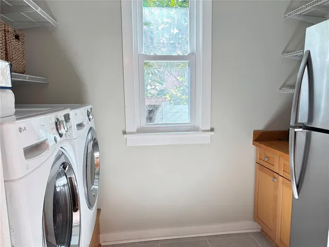 a bathroom with a tub sink and window