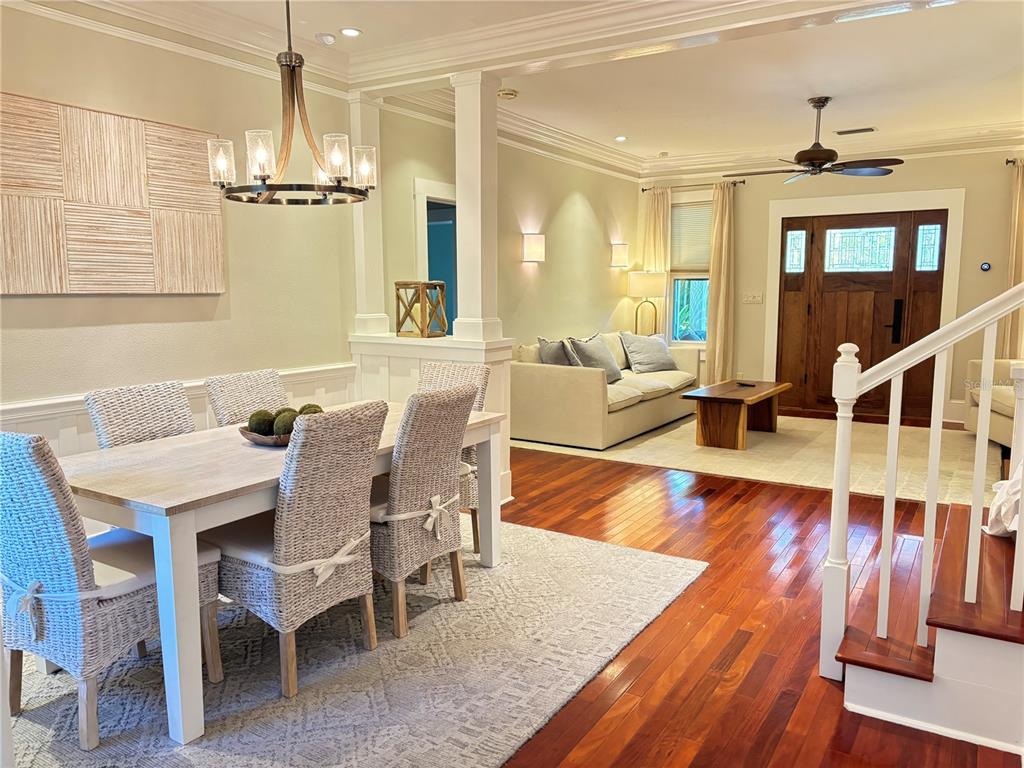 324 Julia Place Sarasota, FL 34236 - Photo 22 of 52 a view of a dining room and livingroom with furniture wooden floor a chandelier