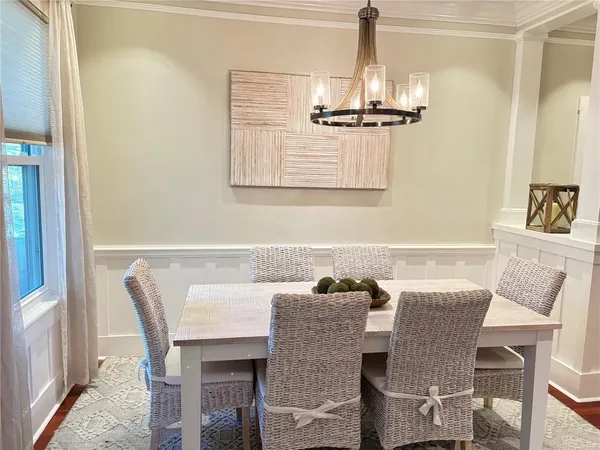 a dining room with furniture and window