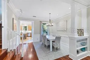 a large bed sitting in a bedroom next to a window
