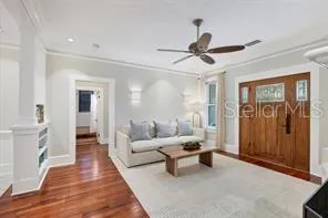 a view of a room with wooden floor and a window