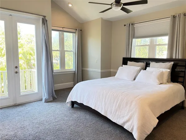 a bedroom with a bed and window