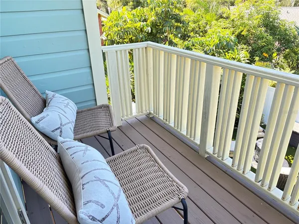 a view of balcony with wooden floor