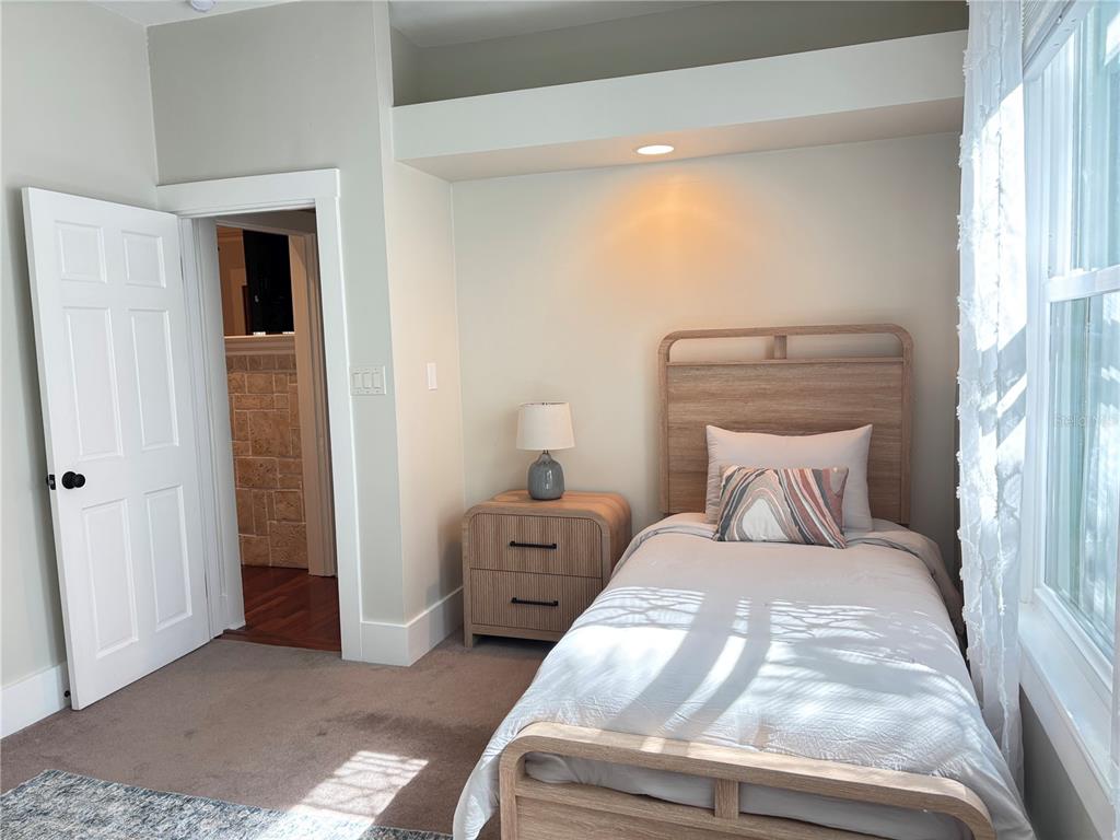 324 Julia Place Sarasota, FL 34236 - Photo 42 of 52 a bedroom with a bed and a window