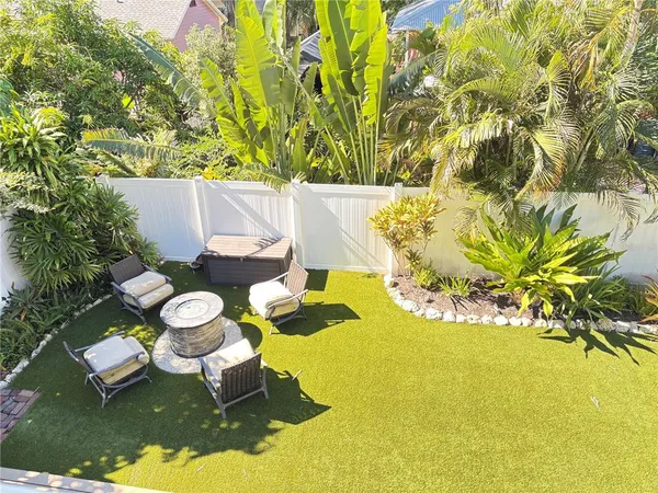 a view of a swimming pool with some plants