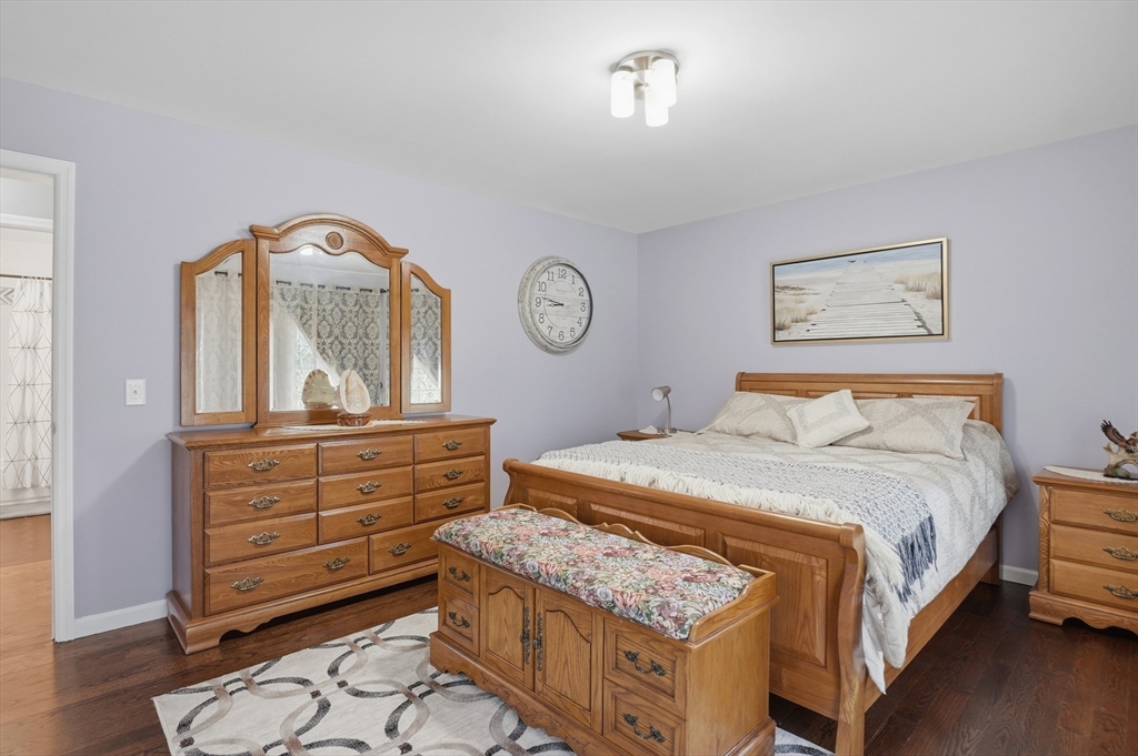 112 Pineland Avenue Worcester, MA 01604 - Photo 27 of 38 a bedroom with a bed and a dresser