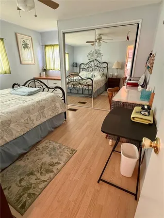 a bedroom with furniture and a window