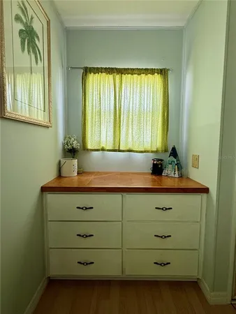 a view of room with window and furniture