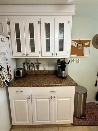 a kitchen with stainless steel appliances granite countertop a sink and cabinets