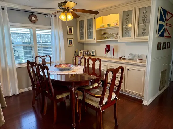a dining room with furniture and window