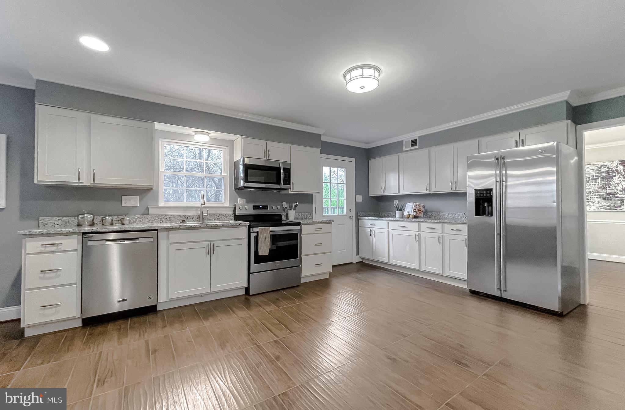 2711 Enterprise Road Bowie, MD 20721 - Photo 5 of 56 Large kitchen with access to patio