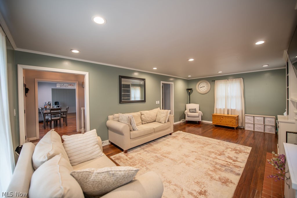 827 East 5th Street Dover, OH 44622 - Photo 11 of 38 Spacious living room featuring a cozy fireplace