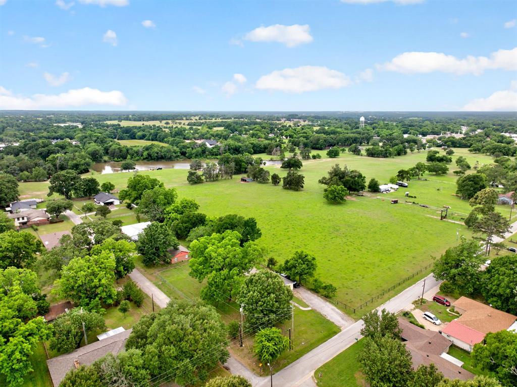610 Crooked Creek Road Edgewood, TX 75117 - Photo 31 of 33 an aerial view of ocean and residential houses with outdoor space