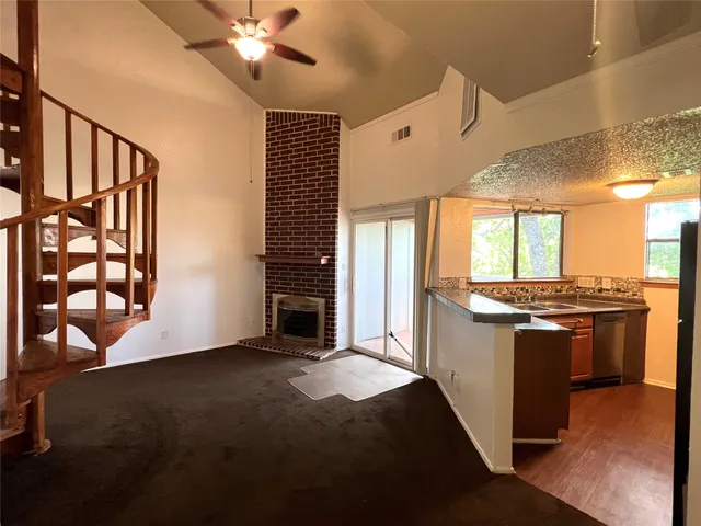 a kitchen with stainless steel appliances granite countertop a stove and a refrigerator