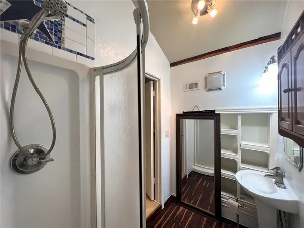 a bathroom with a sink and mirror