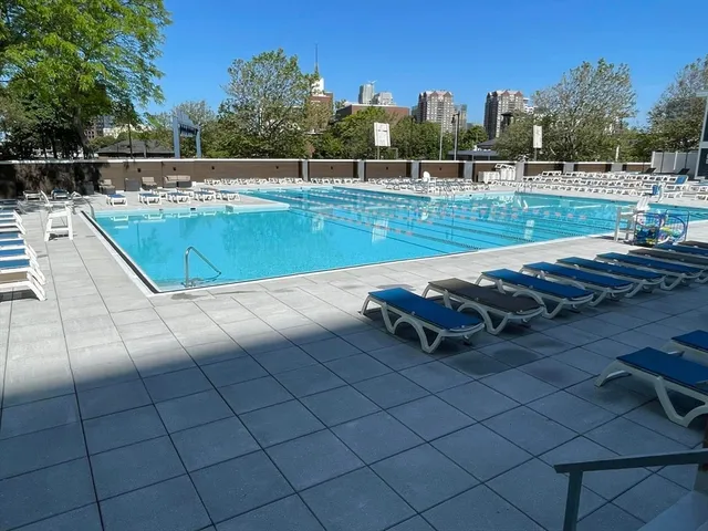 a view of a swimming pool with a patio