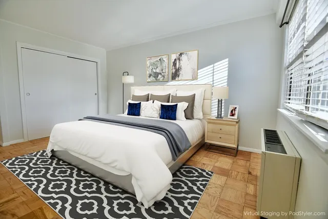 a bedroom with double bed and a window