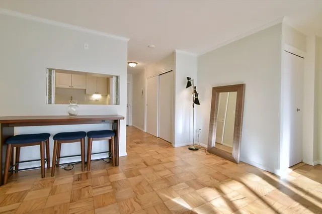 a view of room with a sink and a kitchen