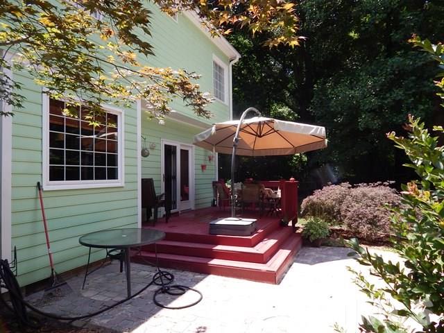 1505 Park Ridge Way Raleigh, NC 27614 - Photo 22 of 25 a backyard of a house with table and chairs