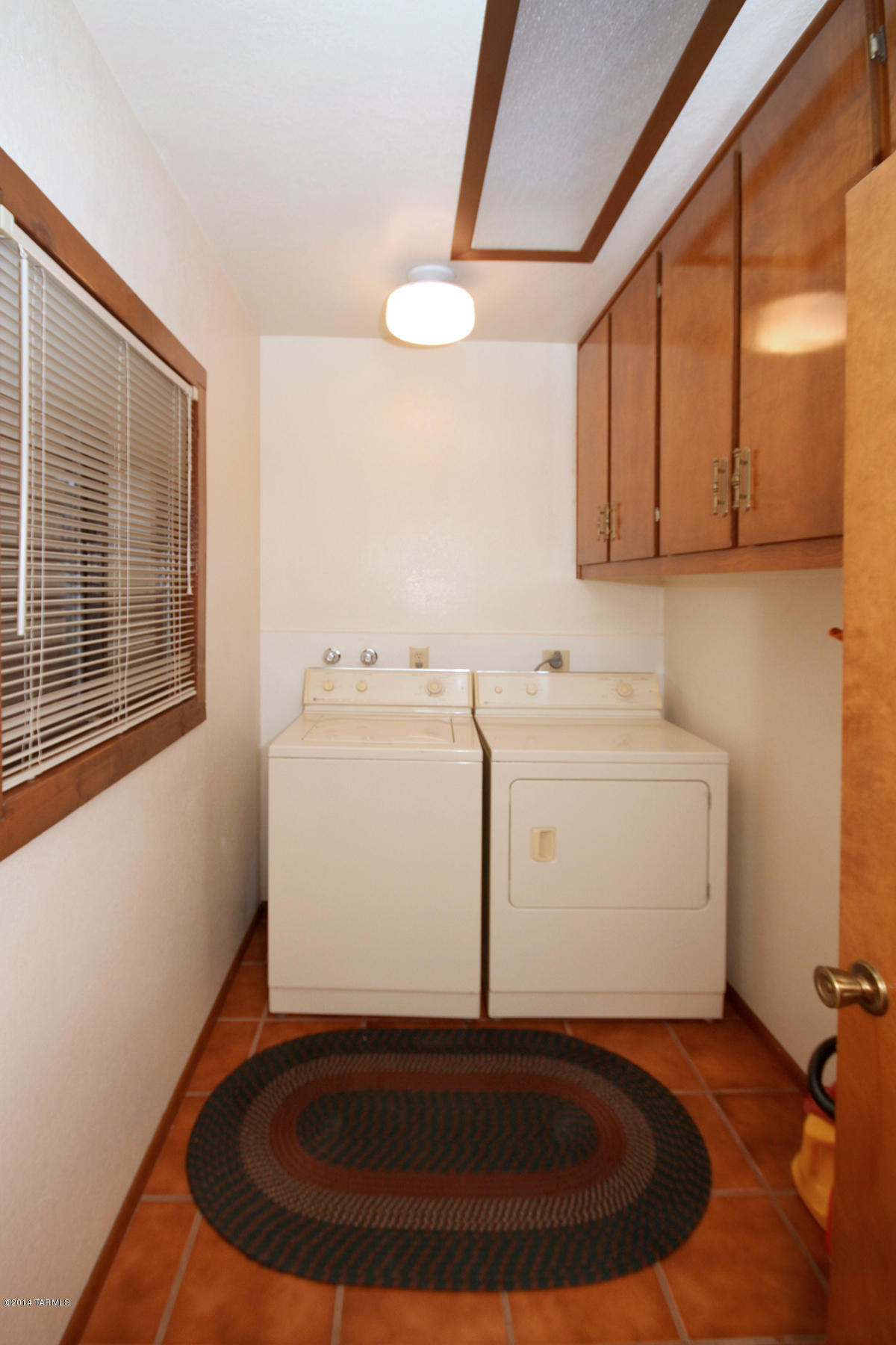 10882 East Escalante Road Tucson, AZ 85730 - Photo 26 of 29 Laundry Rm w/Built In Storage