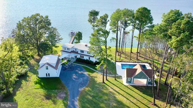 a view of a patio with table and chairs under an umbrella