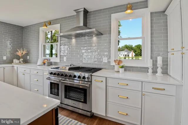 a living room with furniture and a window with balcony view