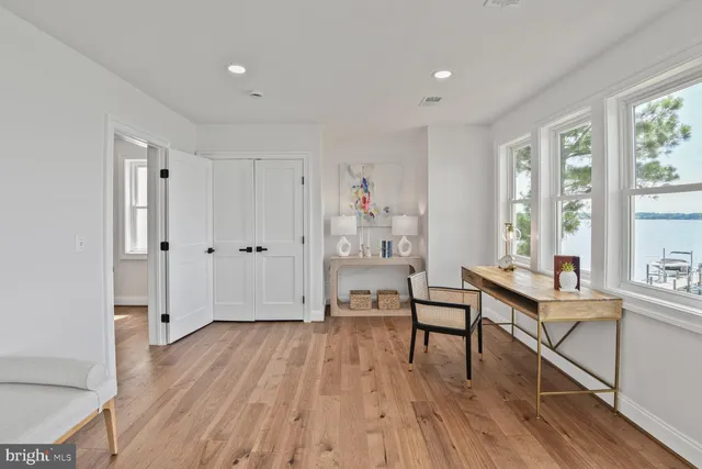 a bathroom with a granite countertop sink a mirror and shower