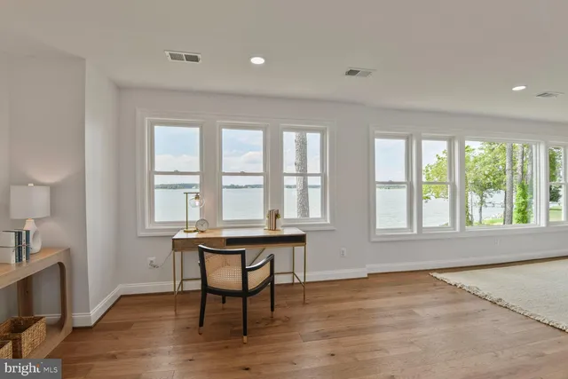 a front view of a residential houses with yard and green space