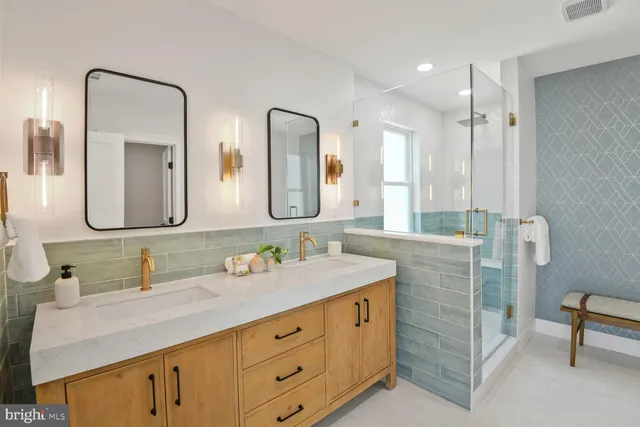 a view of an ocean from a balcony with furniture